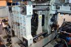 Used Uniloy Milacron Alkam Stretch Blow Molding Machine, Model BM-4. (4) Blow cavities/mould, 130mm distance between cavities. Unit includes an infeed system with a hopper, elevator, orienter, and in...