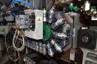 Used Uniloy Milacron Alkam Stretch Blow Molding Machine, Model BM-4. (4) Blow cavities/mould, 130mm distance between cavities. Unit includes an infeed system with a hopper, elevator, orienter, and in...