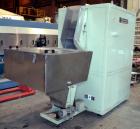 Used Uniloy Milacron Alkam Stretch Blow Molding Machine, Model BM-4. (4) Blow cavities/mould, 130mm distance between cavities. Unit includes an infeed system with a hopper, elevator, orienter, and in...