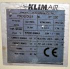 Used Uniloy Milacron Alkam Stretch Blow Molding Machine, Model BM-4. (4) Blow cavities/mould, 130mm distance between cavities. Unit includes an infeed system with a hopper, elevator, orienter, and in...