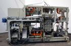 Used Uniloy Milacron Alkam Stretch Blow Molding Machine, Model BM-5. (5) Blow cavities/mould, 105mm distance between cavities. Unit includes an infeed system with a hopper, elevator, orienter, and in...
