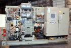 Used Uniloy Milacron Alkam Stretch Blow Molding Machine, Model BM-5. (5) Blow cavities/mould, 105mm distance between cavities. Unit includes an infeed system with a hopper, elevator, orienter, and in...