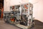 Used Uniloy Milacron Alkam Stretch Blow Molding Machine, Model BM-5. (5) Blow cavities/mould, 105mm distance between cavities. Unit includes an infeed system with a hopper, elevator, orienter, and in...
