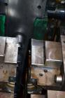 Used Uniloy Milacron Alkam Stretch Blow Molding Machine, Model BM-5. (5) Blow cavities/mould, 105mm distance between cavities. Unit includes an infeed system with a hopper, elevator, orienter, and in...