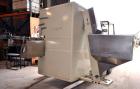 Used Uniloy Milacron Alkam Stretch Blow Molding Machine, Model BM-5. (5) Blow cavities/mould, 105mm distance between cavities. Unit includes an infeed system with a hopper, elevator, orienter, and in...