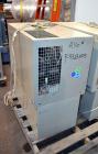 Used Uniloy Milacron Alkam Stretch Blow Molding Machine, Model BM-5. (5) Blow cavities/mould, 105mm distance between cavities. Unit includes an infeed system with a hopper, elevator, orienter, and in...