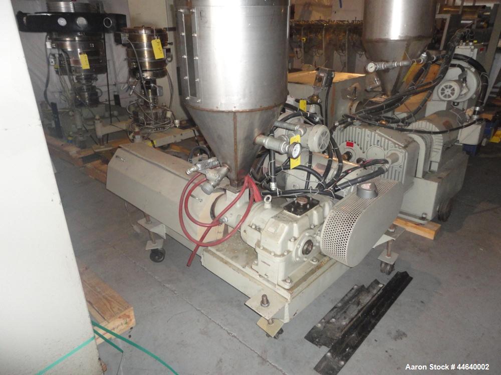 Used Battenfeld Three Layer Blown Film Line consisting of the following: 2" Battenfeld extruder, 30:1 L/D, electrically heated, water cooled, feed hopper with 50 hp DC motor with SCR controller, 2" B...