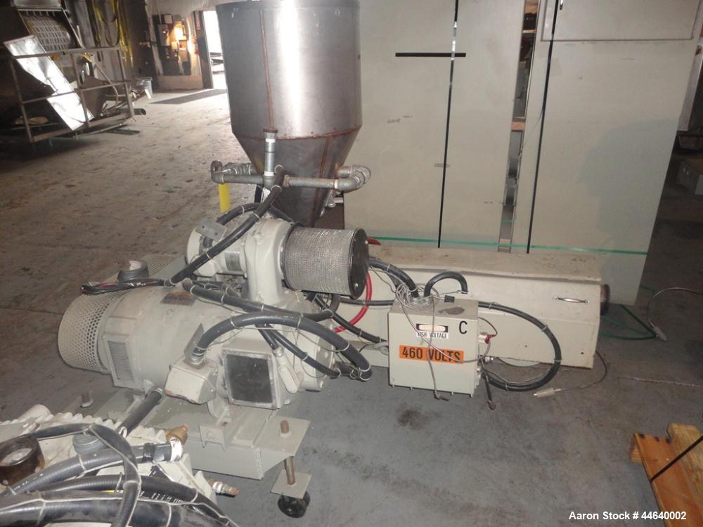 Used Battenfeld Three Layer Blown Film Line consisting of the following: 2" Battenfeld extruder, 30:1 L/D, electrically heated, water cooled, feed hopper with 50 hp DC motor with SCR controller, 2" B...