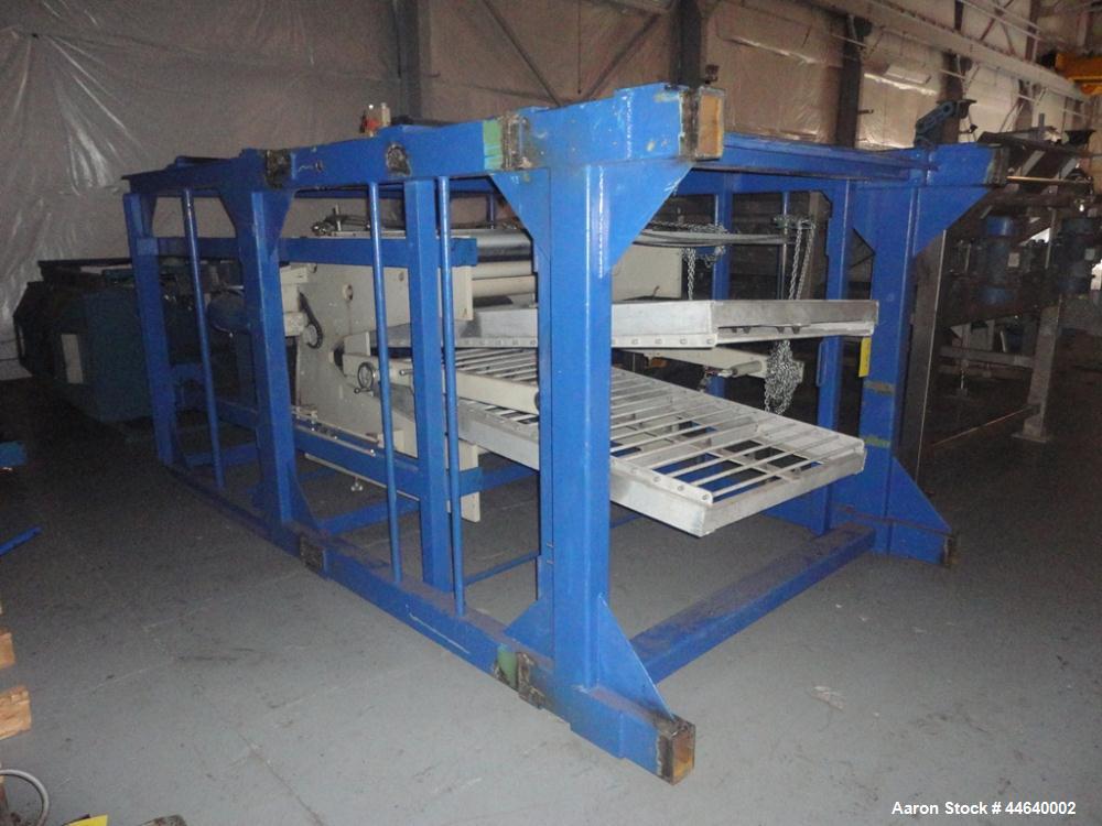 Used Battenfeld Three Layer Blown Film Line consisting of the following: 2" Battenfeld extruder, 30:1 L/D, electrically heated, water cooled, feed hopper with 50 hp DC motor with SCR controller, 2" B...