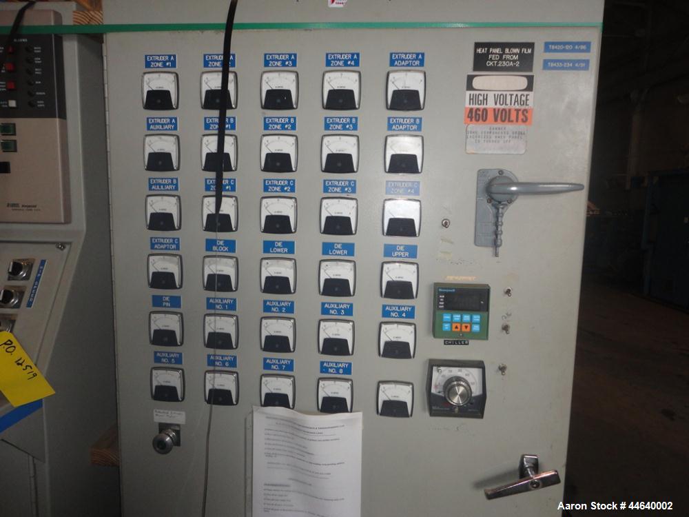 Used Battenfeld Three Layer Blown Film Line consisting of the following: 2" Battenfeld extruder, 30:1 L/D, electrically heated, water cooled, feed hopper with 50 hp DC motor with SCR controller, 2" B...