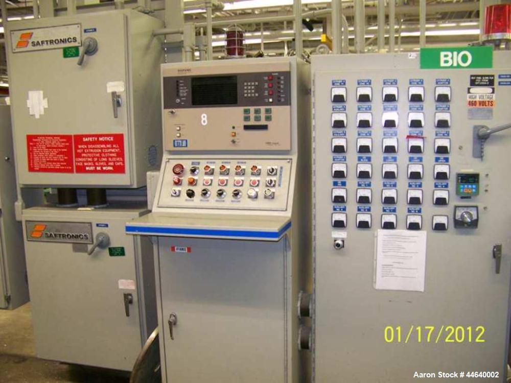 Used Battenfeld Three Layer Blown Film Line consisting of the following: 2" Battenfeld extruder, 30:1 L/D, electrically heated, water cooled, feed hopper with 50 hp DC motor with SCR controller, 2" B...