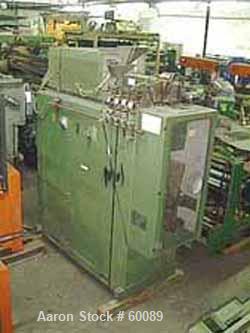 USED: Brabender downward lab line with a 1" extruder with variablespeed motor and a 1" blown film die. Includes a 4 zone temperaturecontroller with: extruder variable pot and digital rpm gauge, varia...