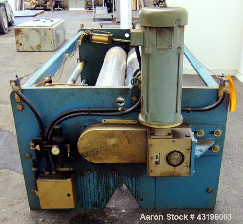 Used Nip Roll Assembly Consisting Of: (1) 10" Diameter x 84" long stationary metal roll, driven by a 3hp, 180 volt, 1750 rpm DC gear motor, ratio 15 to 1, (1) 10" diameter x 84" wide pneumatically ad...