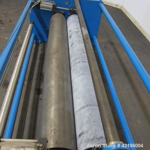 Used Nip Roll Assembly Consisting Of: (1) 10" Diameter x 84" long stationary metal roll, driven by a 3hp, 180 volt, 1750 rpm DC gear motor, ratio 15 to 1, (1) 10" diameter x 84" wide pneumatically ad...