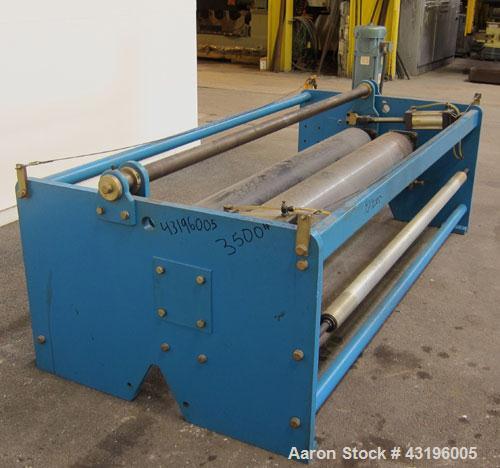 Used Nip Roll Assembly Consisting Of: (1) 10" Diameter x 84" long stationary metal roll, driven by a 3hp, 180 volt, 1750 rpm DC gear motor, ratio 15 to 1, (1) 10" diameter x 84" wide pneumatically ad...