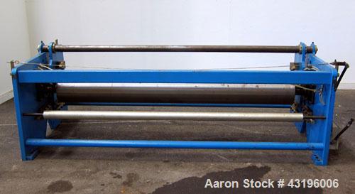 Used Nip Roll Assembly Consisting Of: (1) 10" Diameter x 84" long stationary metal roll. Missing drive, and rubber roll. Mounted on a carbon steel frame.