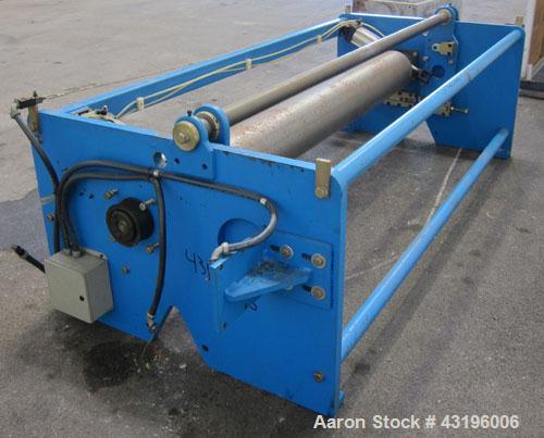 Used Nip Roll Assembly Consisting Of: (1) 10" Diameter x 84" long stationary metal roll. Missing drive, and rubber roll. Mounted on a carbon steel frame.