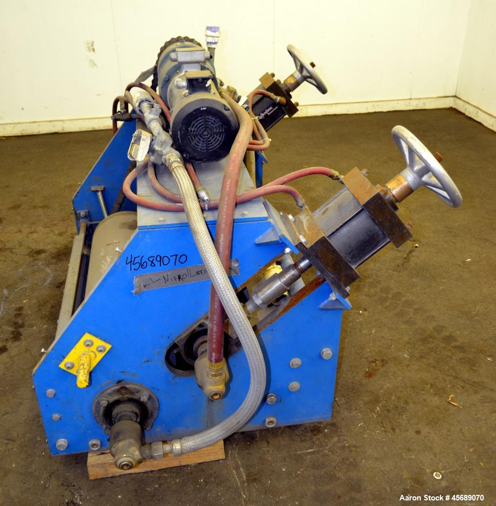 Used APV Chill Roll Stand. (2) Approximate 12" diameter x 32" wide chrome plated cored rolls. (1) Fixed, (1) manually adjustable. Driven by a 1.5hp, 180 volt, 1750 rpm DC gear motor, ratio 129.7 to 1...