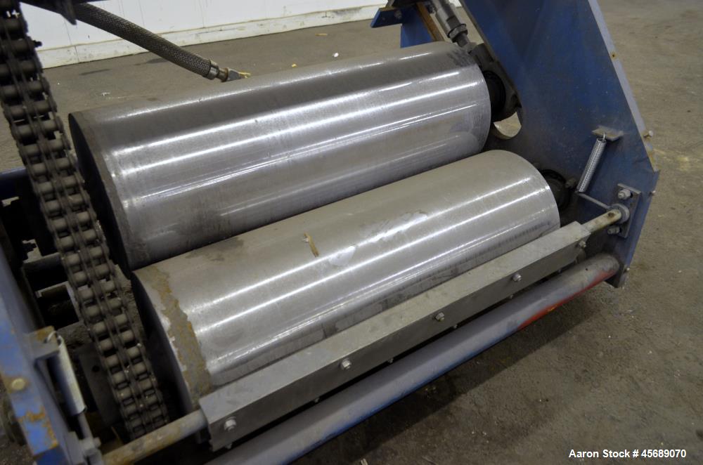 Used APV Chill Roll Stand. (2) Approximate 12" diameter x 32" wide chrome plated cored rolls. (1) Fixed, (1) manually adjustable. Driven by a 1.5hp, 180 volt, 1750 rpm DC gear motor, ratio 129.7 to 1...