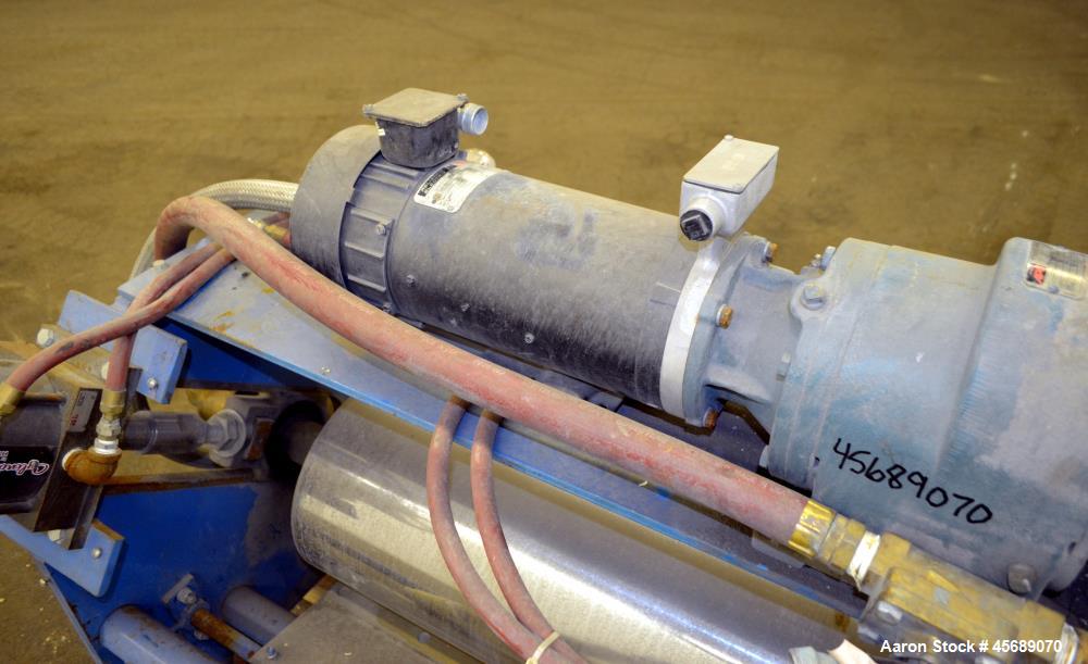 Used APV Chill Roll Stand. (2) Approximate 12" diameter x 32" wide chrome plated cored rolls. (1) Fixed, (1) manually adjustable. Driven by a 1.5hp, 180 volt, 1750 rpm DC gear motor, ratio 129.7 to 1...