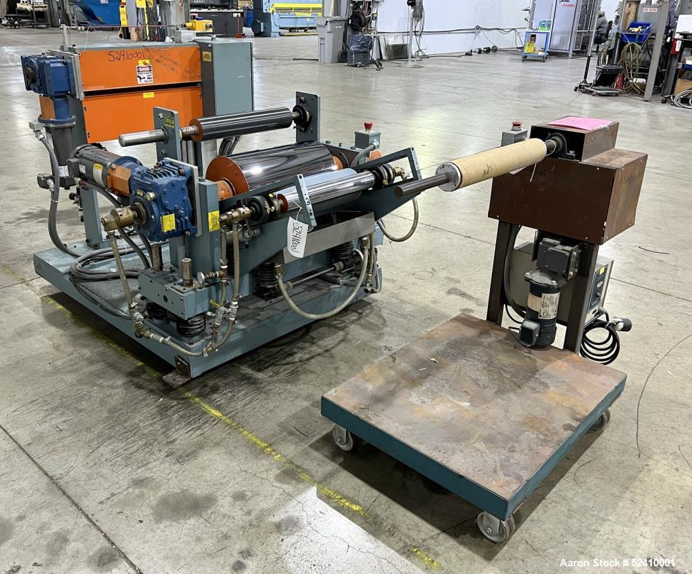 Used Davis Standard Cast Film Stand, Model KXE-1220. (2) 20" wide x 6" diameter feed rolls (1) chrome plated, (1) urethane. Driven by a .5hp 1750rpm motor, through reducer 30:1. (1) 20" wide x 4" dia...
