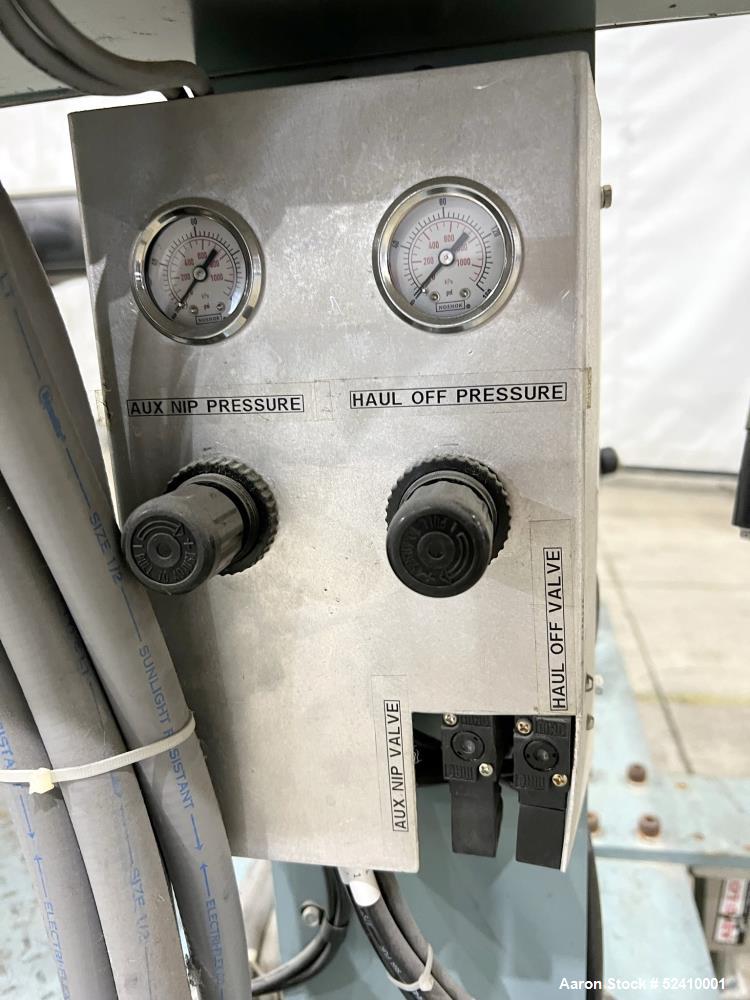 Used Davis Standard Cast Film Stand, Model KXE-1220. (2) 20" wide x 6" diameter feed rolls (1) chrome plated, (1) urethane. Driven by a .5hp 1750rpm motor, through reducer 30:1. (1) 20" wide x 4" dia...