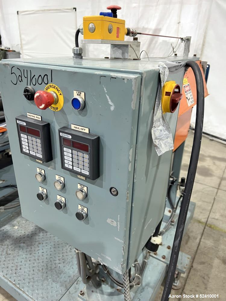 Used Davis Standard Cast Film Stand, Model KXE-1220. (2) 20" wide x 6" diameter feed rolls (1) chrome plated, (1) urethane. Driven by a .5hp 1750rpm motor, through reducer 30:1. (1) 20" wide x 4" dia...