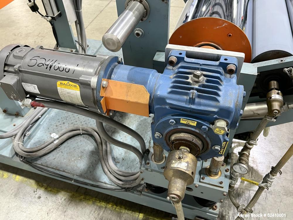 Used Davis Standard Cast Film Stand, Model KXE-1220. (2) 20" wide x 6" diameter feed rolls (1) chrome plated, (1) urethane. Driven by a .5hp 1750rpm motor, through reducer 30:1. (1) 20" wide x 4" dia...