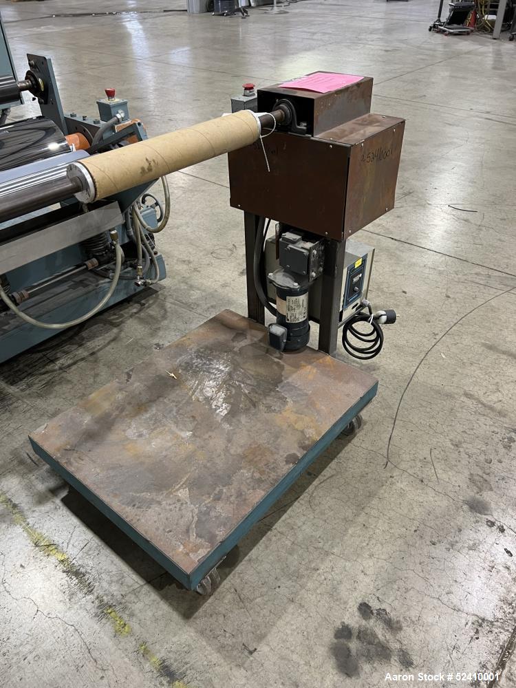Used Davis Standard Cast Film Stand, Model KXE-1220. (2) 20" wide x 6" diameter feed rolls (1) chrome plated, (1) urethane. Driven by a .5hp 1750rpm motor, through reducer 30:1. (1) 20" wide x 4" dia...