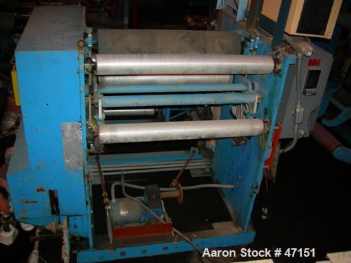 USED: Egan 12" dia x 28" face single roll cast unit. Double roll capable. Cored roll for cooling. With fractional hp drive vr Model 7000 adjustable frequency drive controllers, tensioning stand havin...