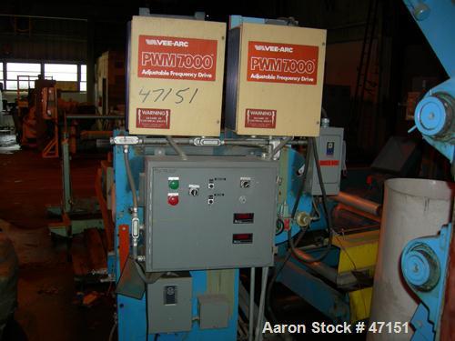 USED: Egan 12" dia x 28" face single roll cast unit. Double roll capable. Cored roll for cooling. With fractional hp drive vr Model 7000 adjustable frequency drive controllers, tensioning stand havin...