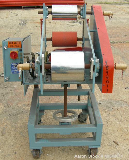 Used Killion Single Roll Cast Film Station. Chrome plated cored roll 8" diameter x 8" wide. Includes (1) 5" diameter x 8" wide rubber roll, (1) 5" diameter x 8" wide chrome plated roll. All rolls are...