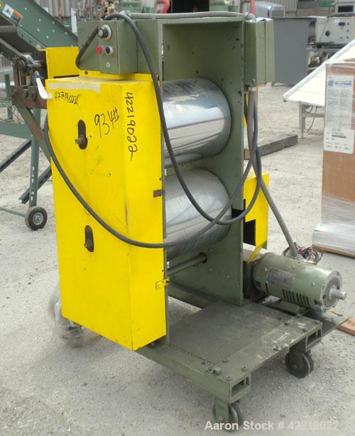 Used 15" Wide Cast Film Roll Stand. (2) 15" wide x 12" diameter chrome plated rolls. (2) 4" diameter x 12" wide rubber pull rolls, driven by a 1/2 hp, 3/60/230/460 volt, 50-1600 rpm motor. Mounted on...