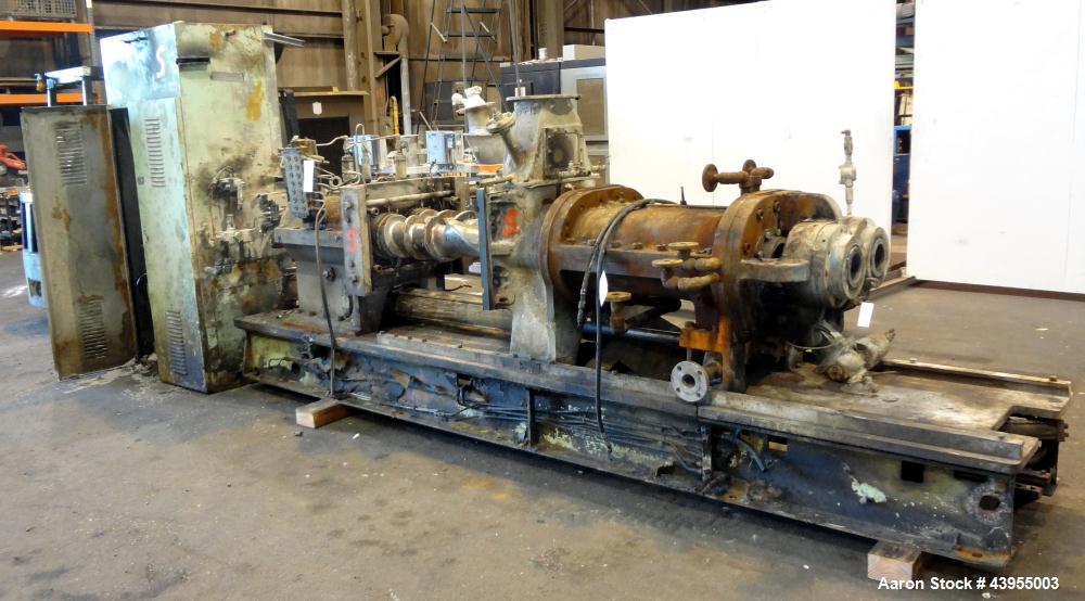 Used Farrel Continuous Mixer, Model 9FCM. Approximate 1881 cubic inch mixing chamber, rated up to 10000 pounds per hour. Jacketed chamber, chrome cored rotors. Approximate 1000hp motor with Lufkin ge...