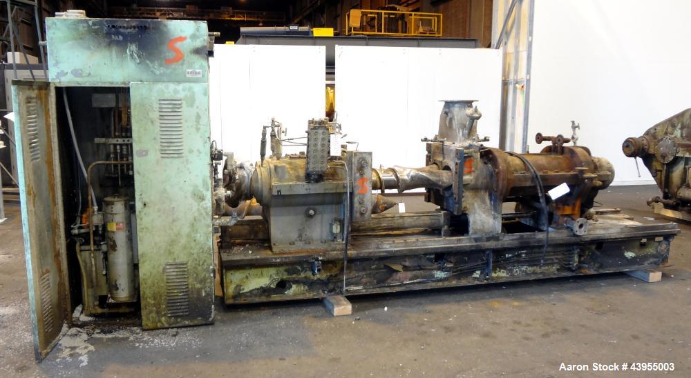 Used Farrel Continuous Mixer, Model 9FCM. Approximate 1881 cubic inch mixing chamber, rated up to 10000 pounds per hour. Jacketed chamber, chrome cored rotors. Approximate 1000hp motor with Lufkin ge...