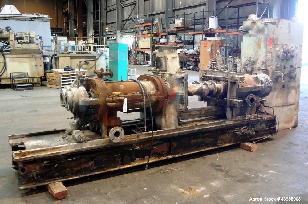Used Farrel Continuous Mixer, Model 9FCM. Approximate 1881 cubic inch mixing chamber, rated up to 10000 pounds per hour. Jacketed chamber, chrome cored rotors. Approximate 1000hp motor with Lufkin ge...
