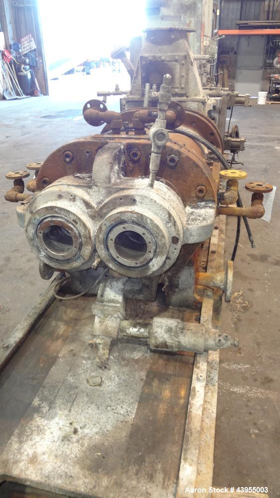 Used Farrel Continuous Mixer, Model 9FCM. Approximate 1881 cubic inch mixing chamber, rated up to 10000 pounds per hour. Jacketed chamber, chrome cored rotors. Approximate 1000hp motor with Lufkin ge...