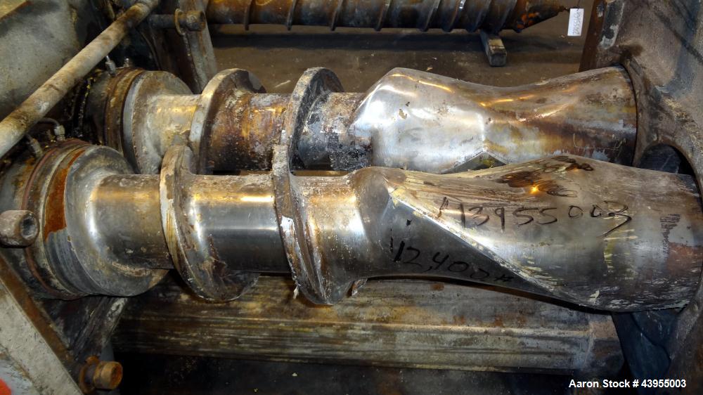 Used Farrel Continuous Mixer, Model 9FCM. Approximate 1881 cubic inch mixing chamber, rated up to 10000 pounds per hour. Jacketed chamber, chrome cored rotors. Approximate 1000hp motor with Lufkin ge...