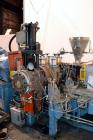 Used Compounding Line Consisting Of: (1) Farrel size 4LMSD Continuous Mixer. Modified top feed, side discharge. Oil heated, over-under rotor design. Driven by a 150hp, 500 volt, 1750 rpm DC motor thr...