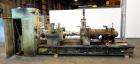 Used Farrel Continuous Mixer, Model 9FCM. Approximate 1881 cubic inch mixing chamber, rated up to 10000 pounds per hour. Jacketed chamber, chrome cored rotors. Approximate 1000hp motor with Lufkin ge...
