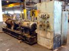 Used Farrel Continuous Mixer, Model 9FCM. Approximate 1881 cubic inch mixing chamber, rated up to 10000 pounds per hour. Jacketed chamber, chrome cored rotors. Approximate 1000hp motor with Lufkin ge...