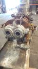 Used Farrel Continuous Mixer, Model 9FCM. Approximate 1881 cubic inch mixing chamber, rated up to 10000 pounds per hour. Jacketed chamber, chrome cored rotors. Approximate 1000hp motor with Lufkin ge...