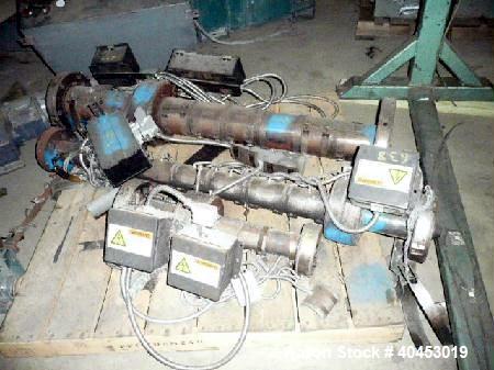 Used Extrusion Dies Inc. Co-extrusion block with various distribution blocks, piping and static mixers, previously used between 5 extruders and die.