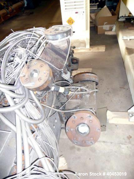 Used Extrusion Dies Inc. Co-extrusion block with various distribution blocks, piping and static mixers, previously used between 5 extruders and die.