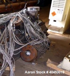 Used Extrusion Dies Inc. Co-extrusion block with various distribution blocks, piping and static mixers, previously used between 5 extruders and die.