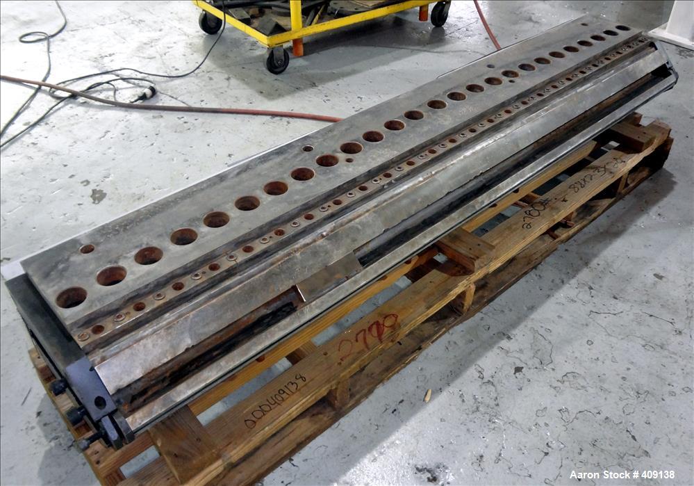 Used 78" wide sheet die. 1" diameter back center feed.