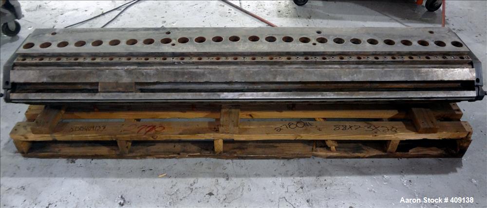 Used 78" wide sheet die. 1" diameter back center feed.