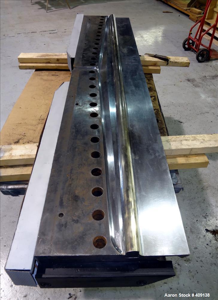 Used 78" wide sheet die. 1" diameter back center feed.