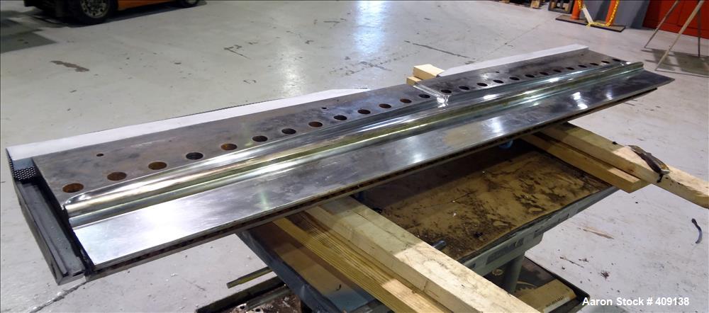 Used 78" wide sheet die. 1" diameter back center feed.