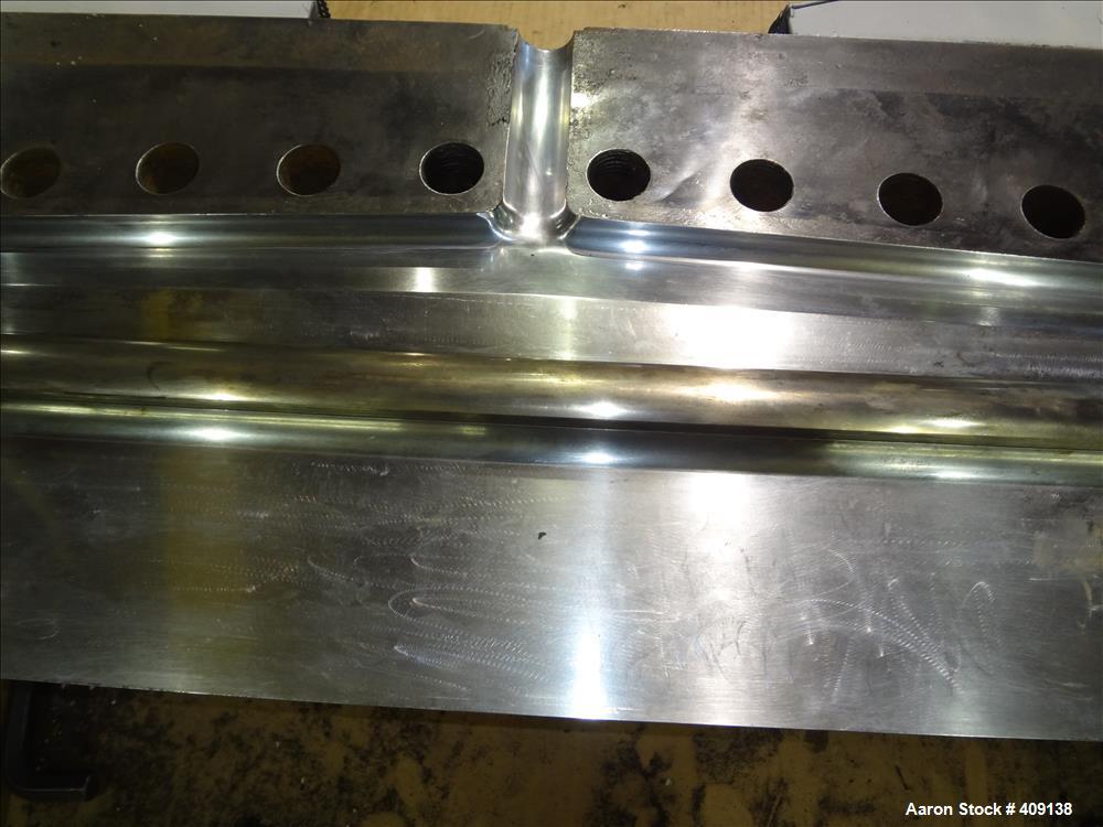Used 78" wide sheet die. 1" diameter back center feed.
